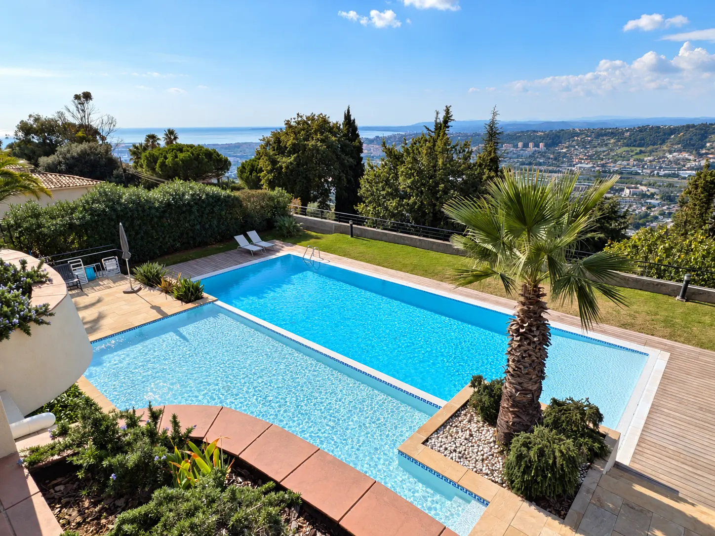The residence's communal pool and the sea